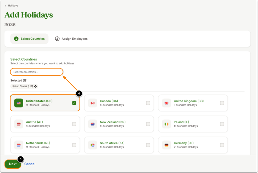 Screenshot of the Add Holidays setup page for 2026 in BambooHR. The progress bar at the top shows step 1 – Select Countries, followed by step 2 – Assign Employees. The interface includes a Search countries field and a list of selectable country cards, each displaying a flag, country name, code, and number of standard holidays. The United States (US) card is highlighted with a green check mark and shows “11 Standard Holidays.” Other visible options include Canada, United Kingdom, Austria, New Zealand, Ireland, Netherlands, South Africa, and Germany. At the bottom-left, a green Next button is highlighted, with a Cancel link beside it.