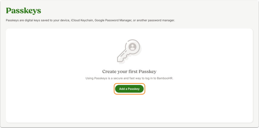 Screenshot of the Passkeys page in BambooHR. The page header explains that passkeys are digital keys saved to your device or password manager. The main panel displays a large button labeled Add a Passkey beneath the text “Create your first Passkey.” A key icon appears above the text.